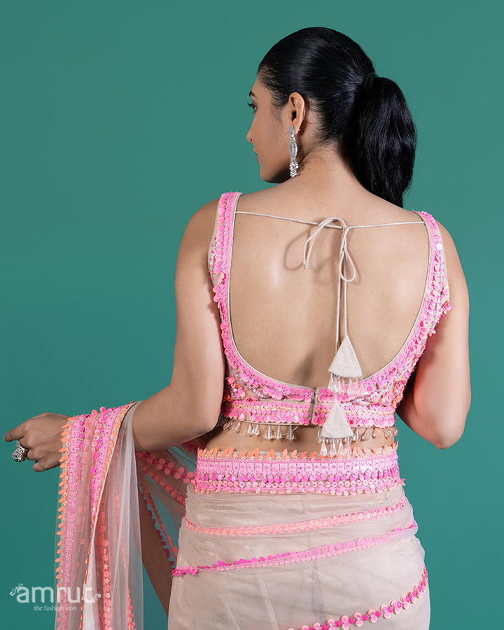 Cream with Pink Sequin Embellished Net Saree and Sleeveless Embellished Blouse