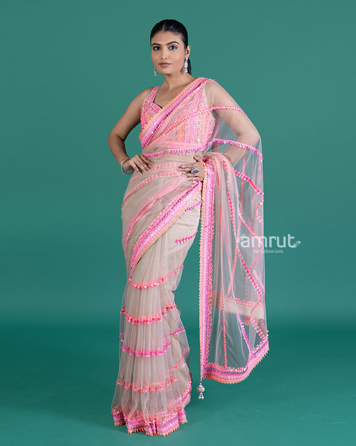 Cream with Pink Sequin Embellished Net Saree and Sleeveless Embellished Blouse