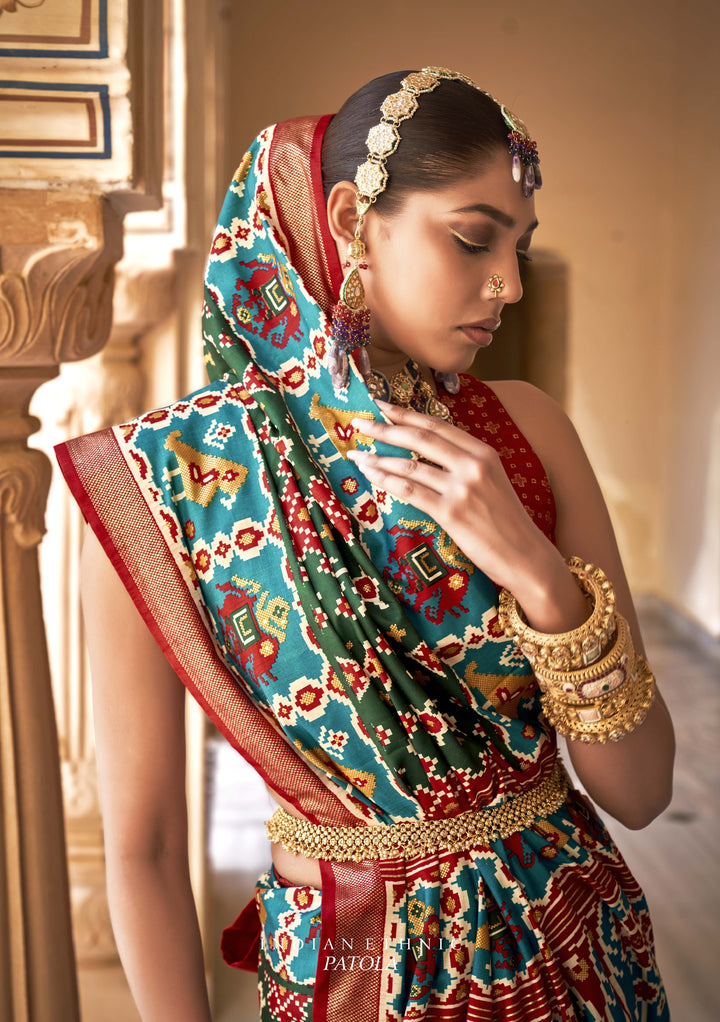 Crimson & Green Patola Silk Saree with Intricate Geometric Weaving, Paired with a Matching Blouse