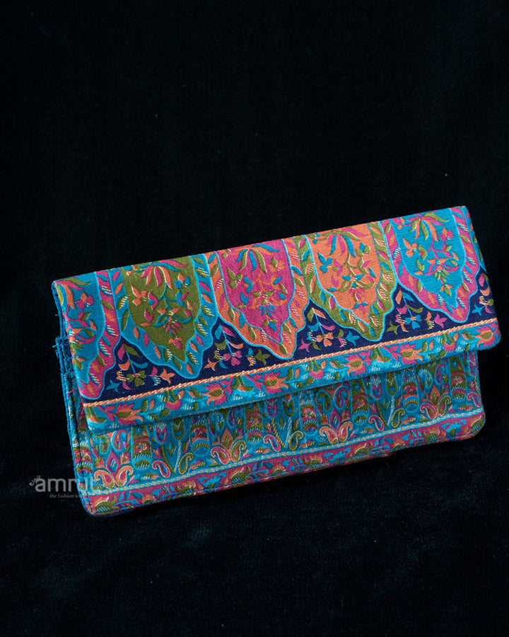 Teal Brocade Clutch with Vibrant Floral and Paisley Motifs Print