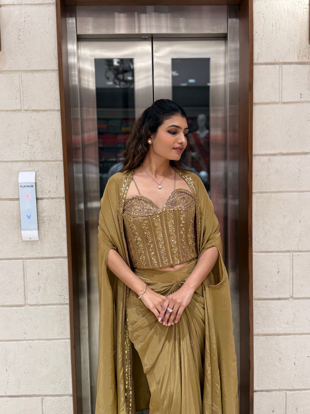 Champagne Gold Draped Saree Set with Embroidered Corset Blouse & Cape