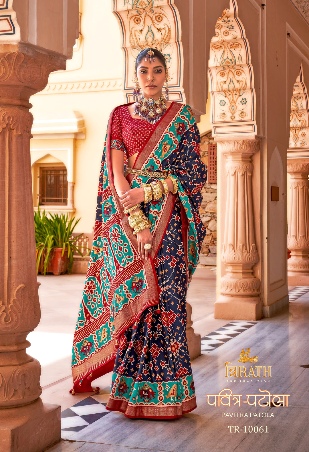 Navy Blue Patola Silk Saree with Intricate Geometric Weaving, Paired with a Matching Red Blouse