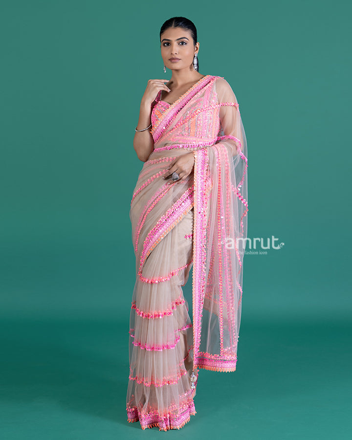 Cream with Pink Sequin Embellished Net Saree and Sleeveless Embellished Blouse