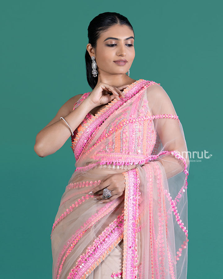 Cream with Pink Sequin Embellished Net Saree and Sleeveless Embellished Blouse