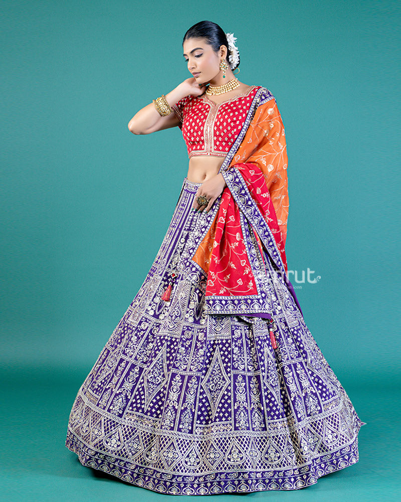 Vibrant Purple Lehenga Crimson Red Choli with Silver Embroidery and Red-Orange Dupatta