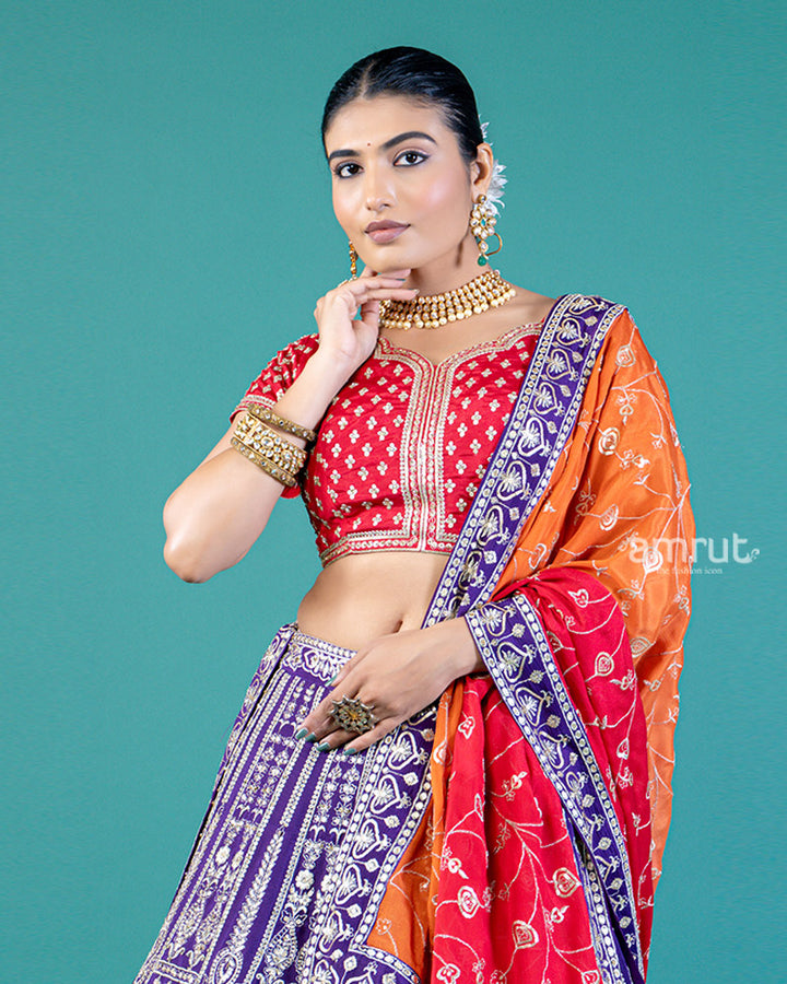 Vibrant Purple Lehenga Crimson Red Choli with Silver Embroidery and Red-Orange Dupatta