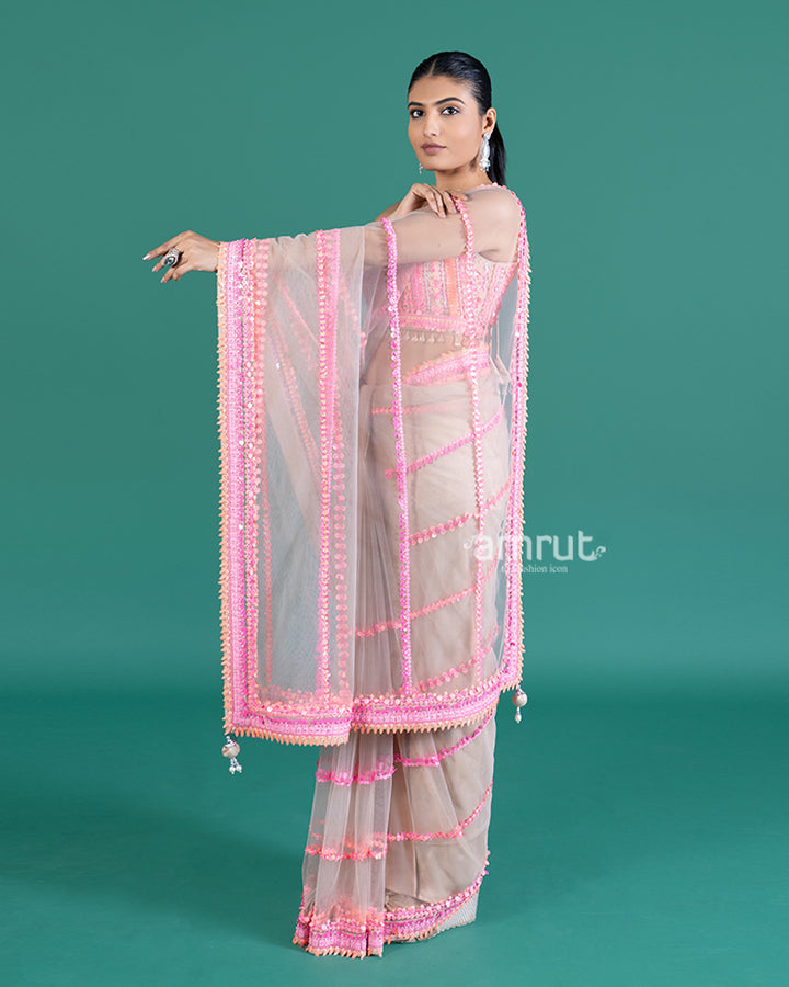 Cream with Pink Sequin Embellished Net Saree and Sleeveless Embellished Blouse