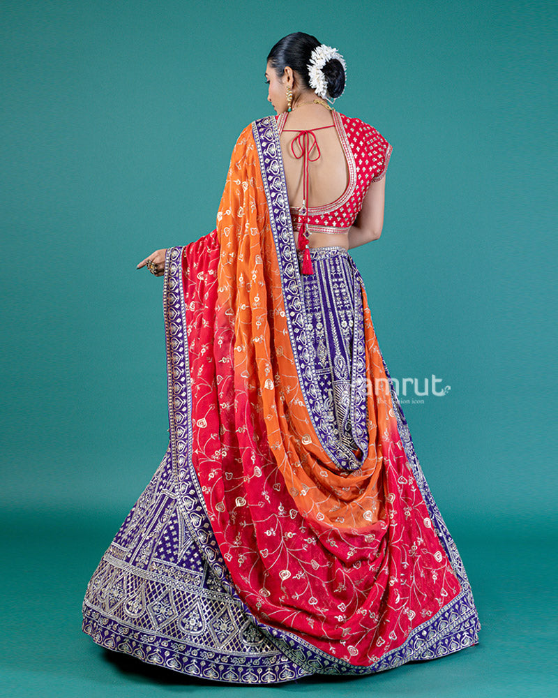 Vibrant Purple Lehenga Crimson Red Choli with Silver Embroidery and Red-Orange Dupatta