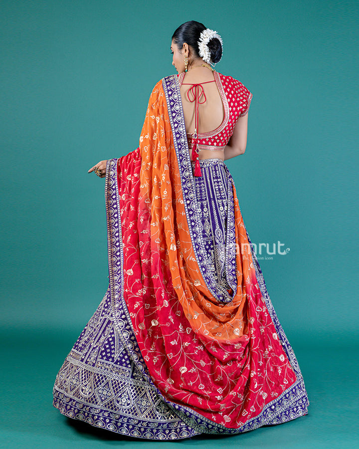 Vibrant Purple Lehenga Crimson Red Choli with Silver Embroidery and Red-Orange Dupatta