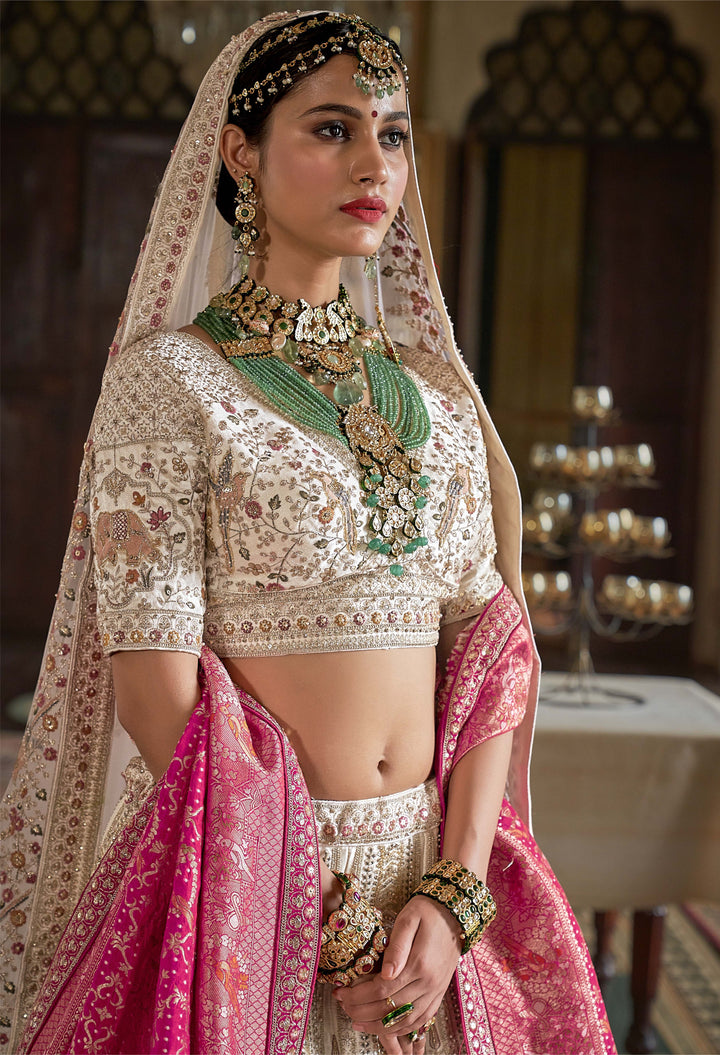 Ivory & Rose Handcrafted Bridal Lehenga with Zardozi and Elephant Motifs
