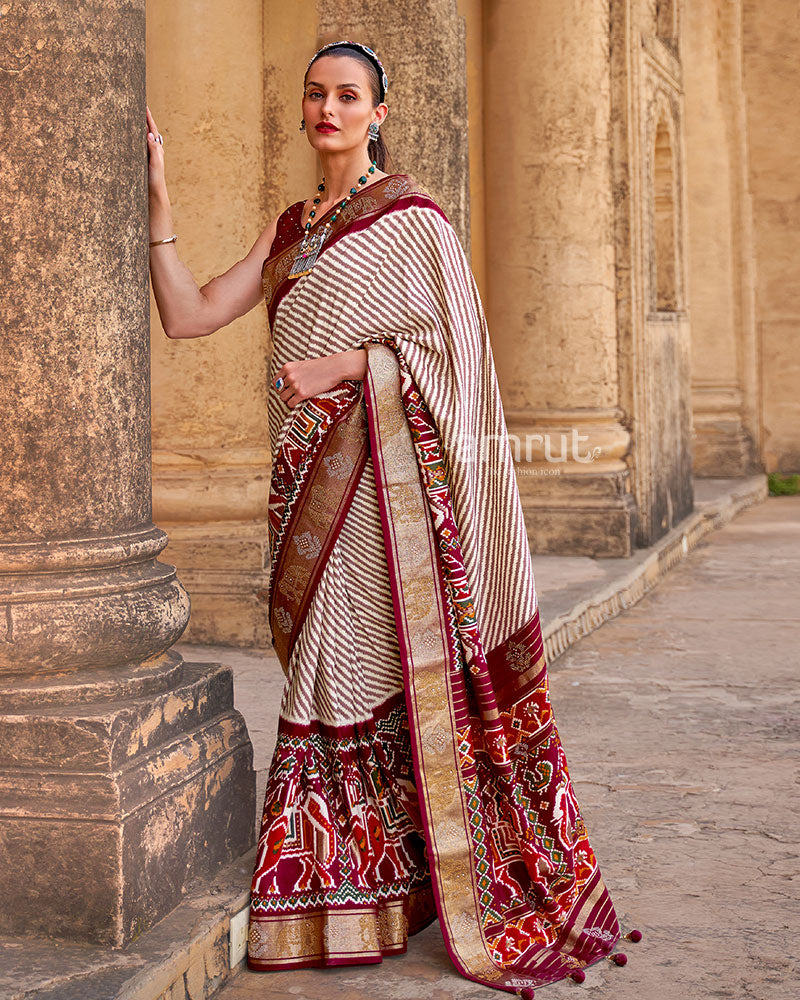 White with Maroon Pallu Patola Saree and Unstitched Blouse