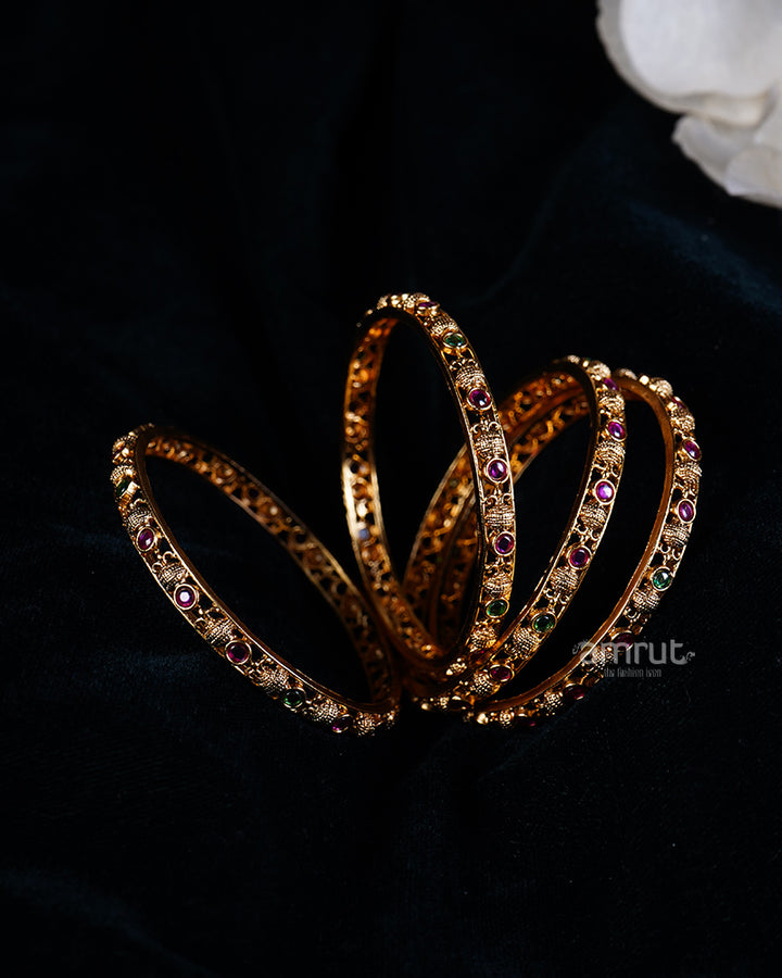 Intricately Designed Gold Bangles with Ruby and Emerald Gemstones