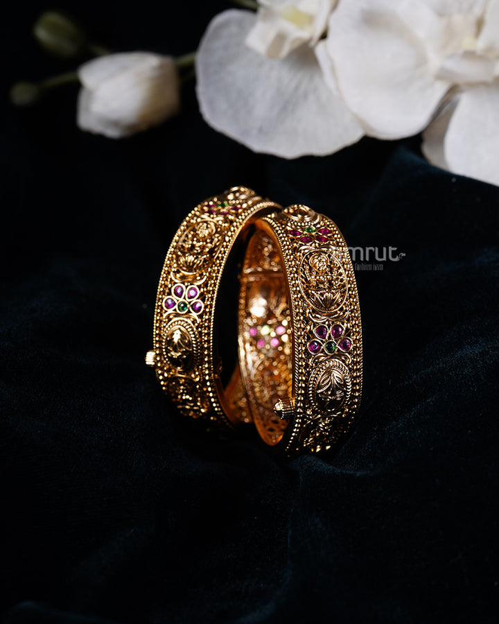 Gold with Intricate Patterns and Red-Green Gemstone Motifs Bangles