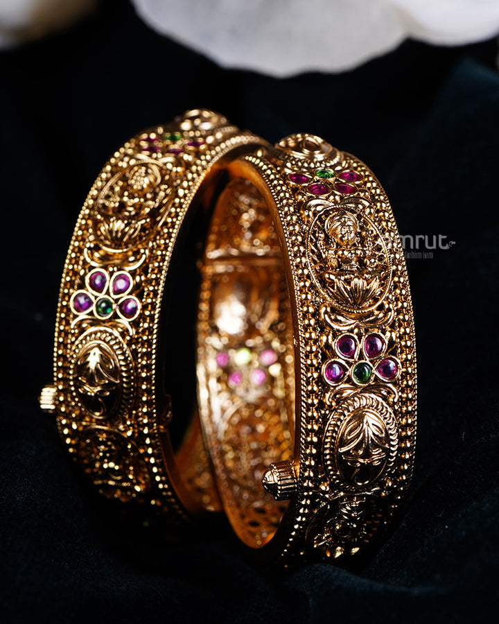 Gold with Intricate Patterns and Red-Green Gemstone Motifs Bangles