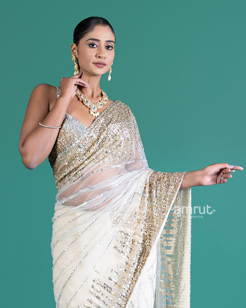 Cream with Golden Silver Sequin Embellishments Net Saree and Embroidered Blouse