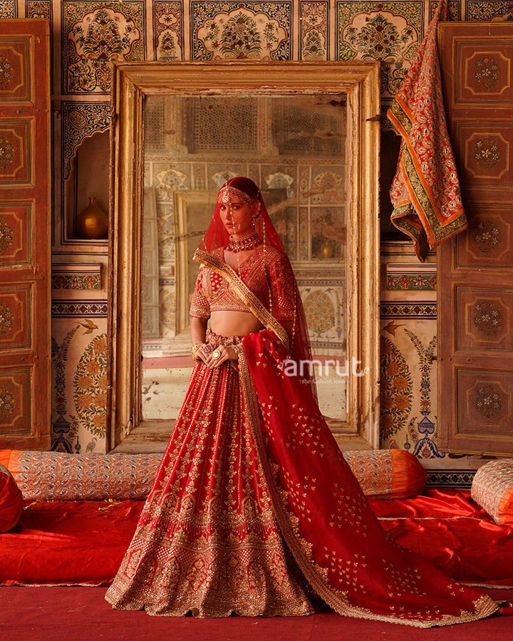 Vibrant Red Golden Embroidered Lehenga Choli with Sheer Net Dupatta