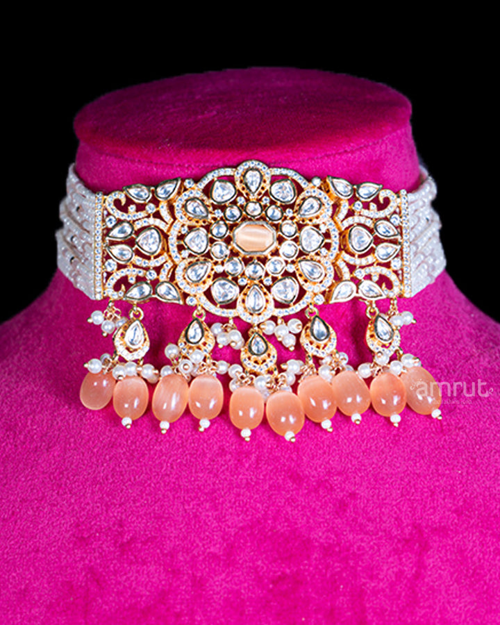 Ornate Gold-Toned Necklace with Pearls, Crystals, and Peach Teardrop Accents