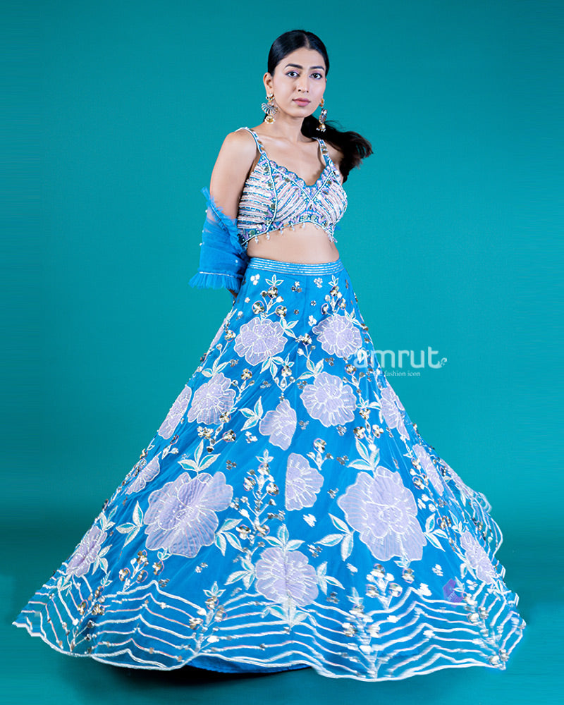 Embellished Sleeveless Sweetheart Neckline Choli with Pickton blue Lehenga and Floral Embroidery