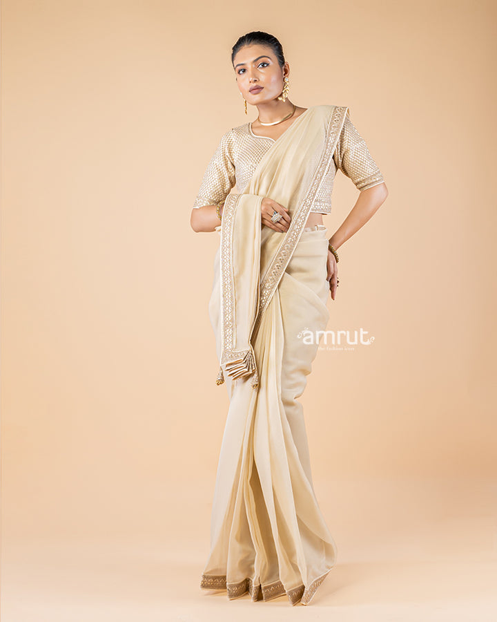 Beige Chiffon Saree With Tassels and Embroidered Stitched Blouse