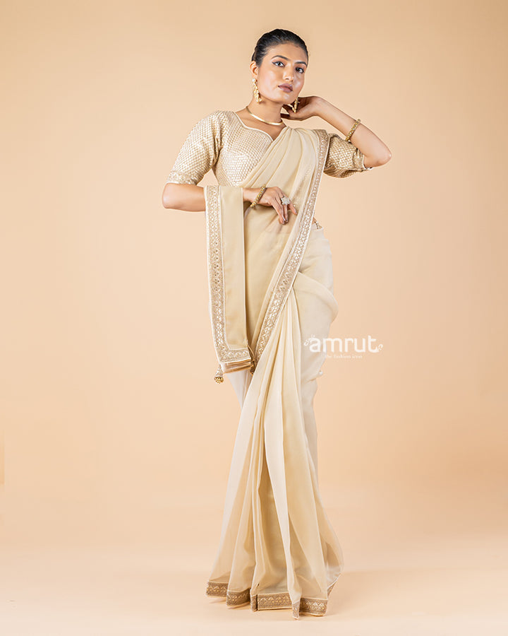 Beige Chiffon Saree With Tassels and Embroidered Stitched Blouse