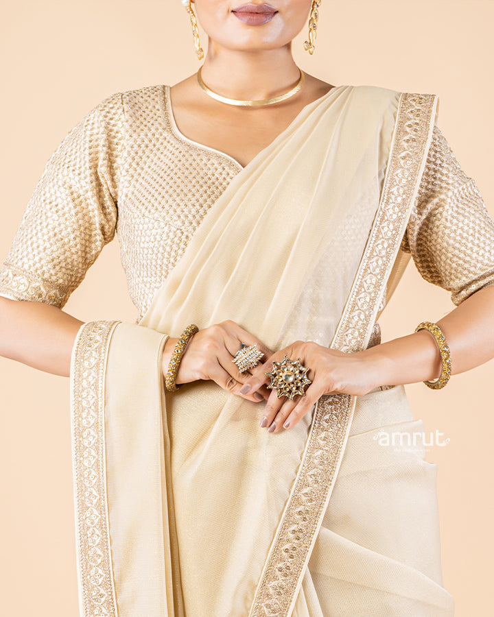 Beige Chiffon Saree With Tassels and Embroidered Stitched Blouse