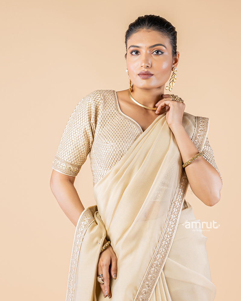 Beige Chiffon Saree With Tassels and Embroidered Stitched Blouse