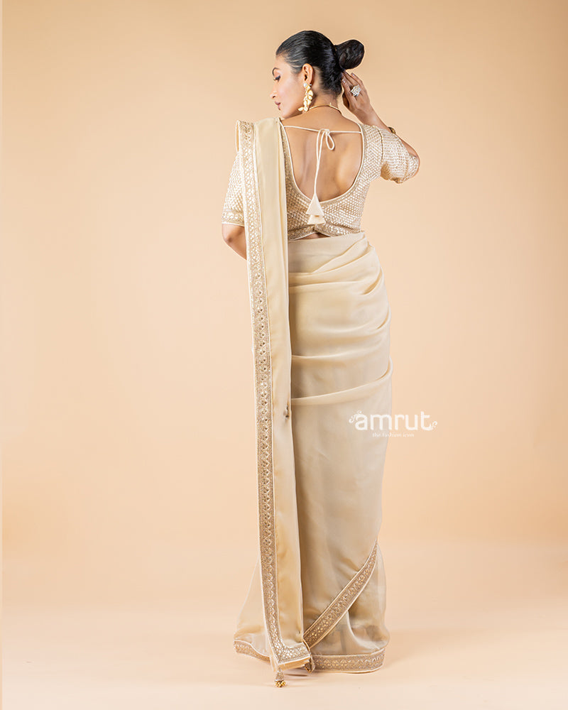 Beige Chiffon Saree With Tassels and Embroidered Stitched Blouse