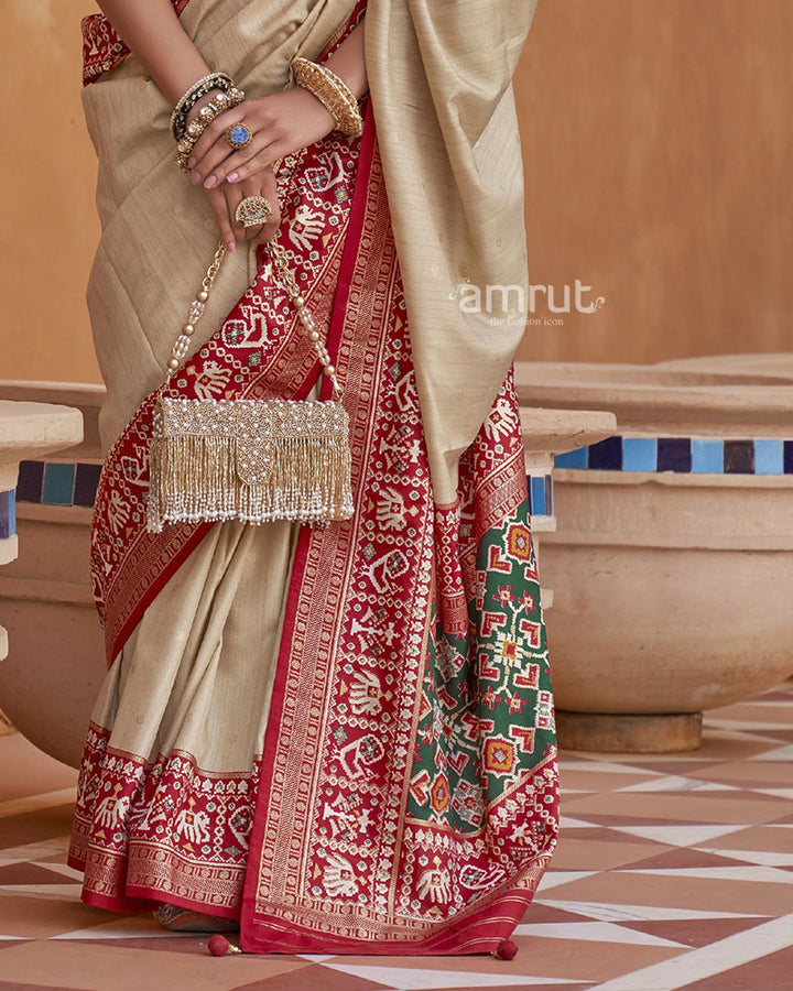 Beige Pure Patola Silk Saree With Printed Border and Unstitched Blouse Piece