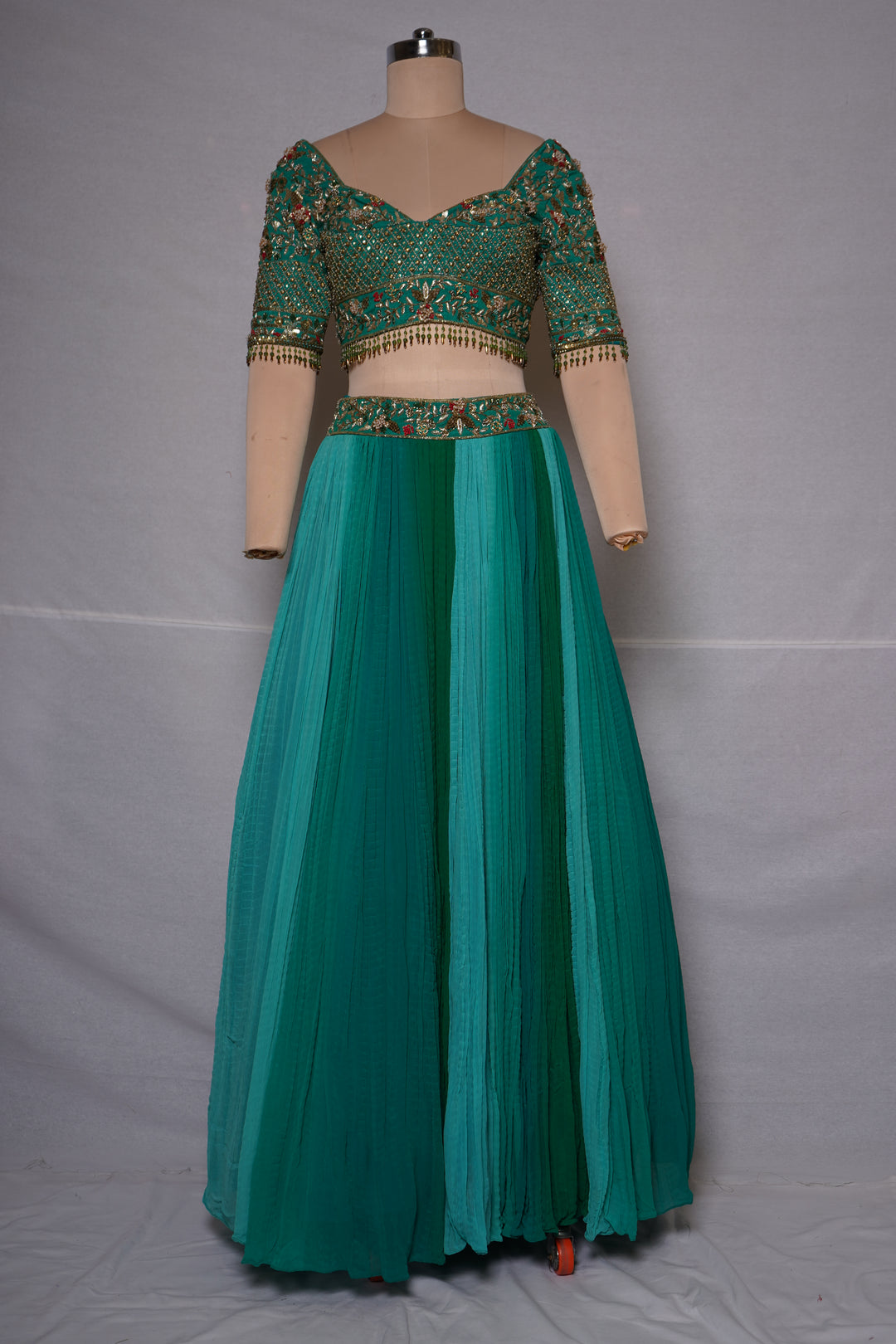 Teal Green Embroidered Crop Top with Pleated Lehenga Skirt