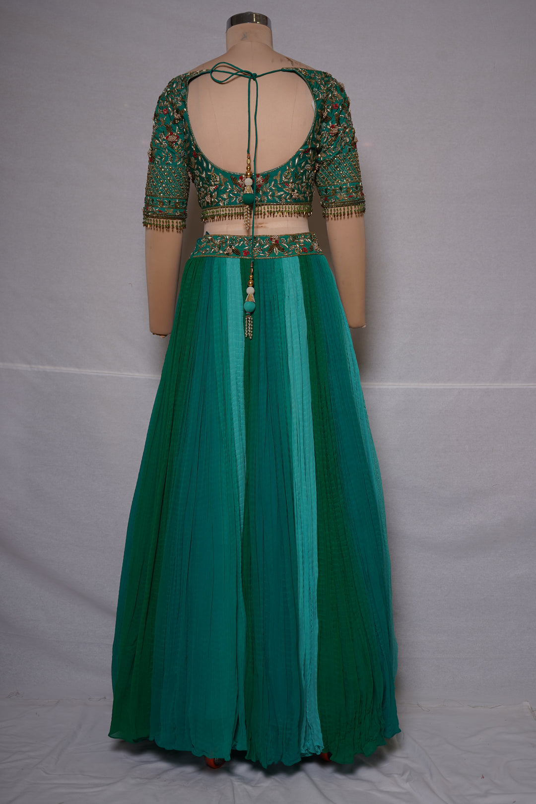 Teal Green Embroidered Crop Top with Pleated Lehenga Skirt