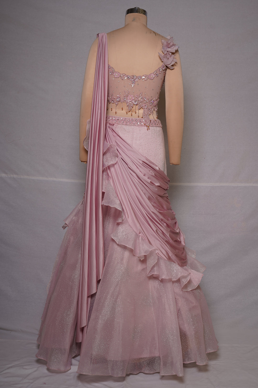 Blush Pink Embellished Ruffle Lehenga Saree with Floral Shoulder Accent