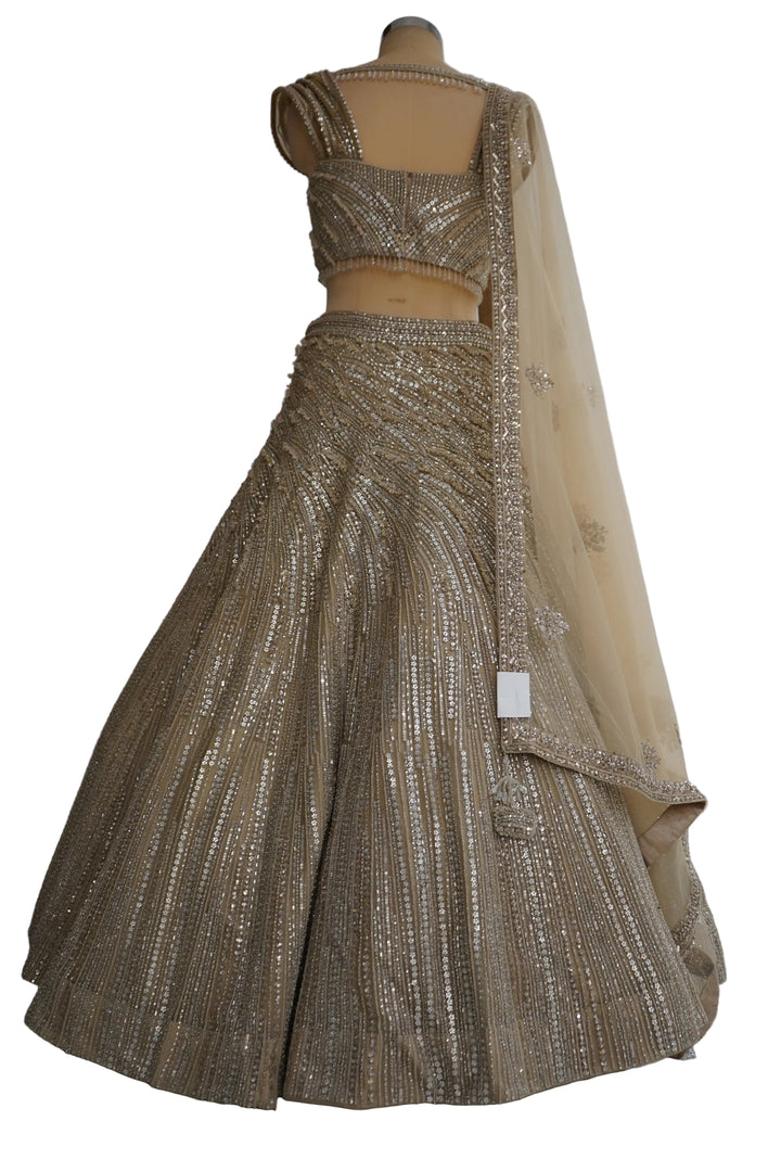 Champagne Gold Designer Lehenga Set with Embellished Blouse and Net Dupatta