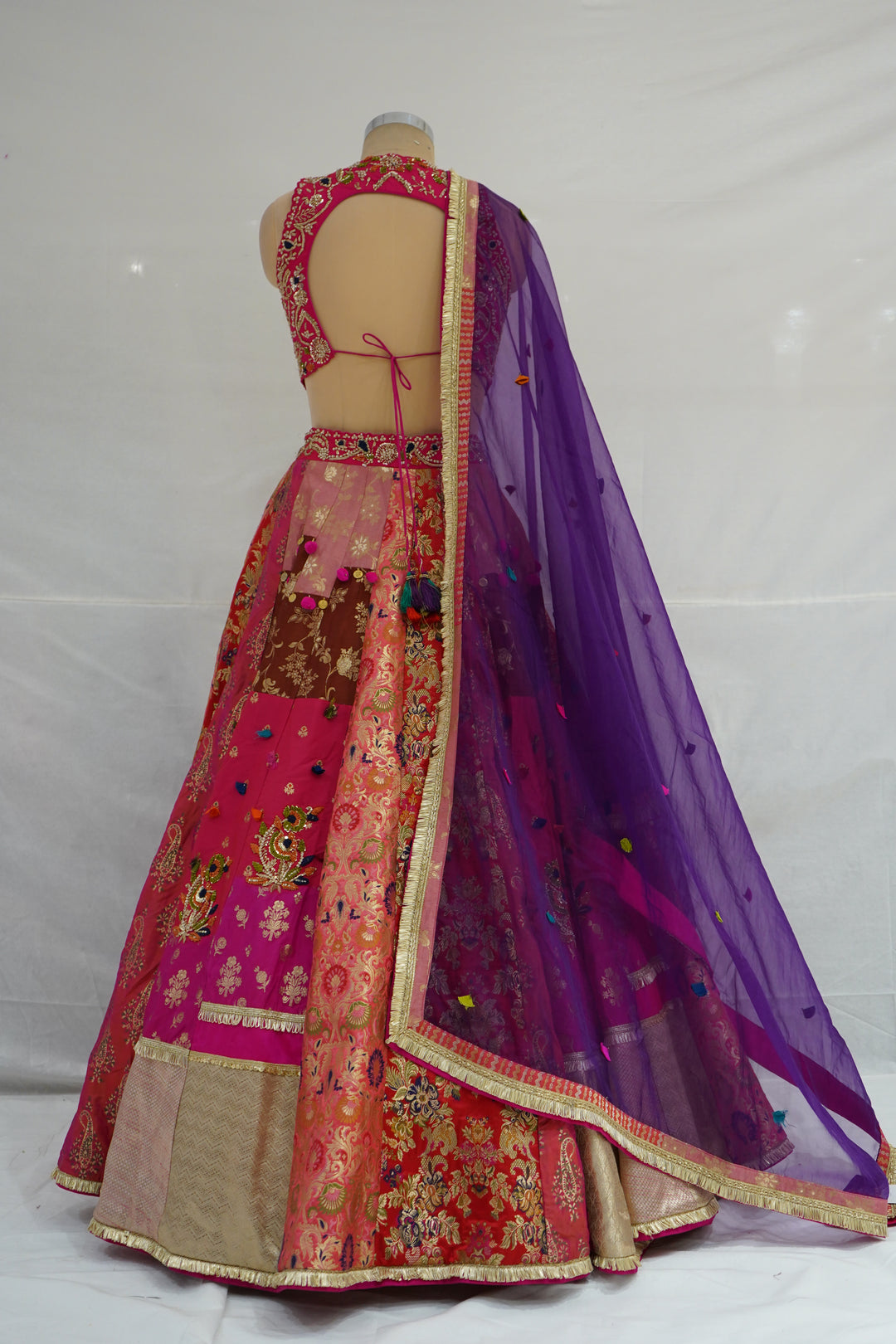 Rani Pink & Multicolour Banarasi Woven Designer Lehenga Choli with Purple Net Dupatta