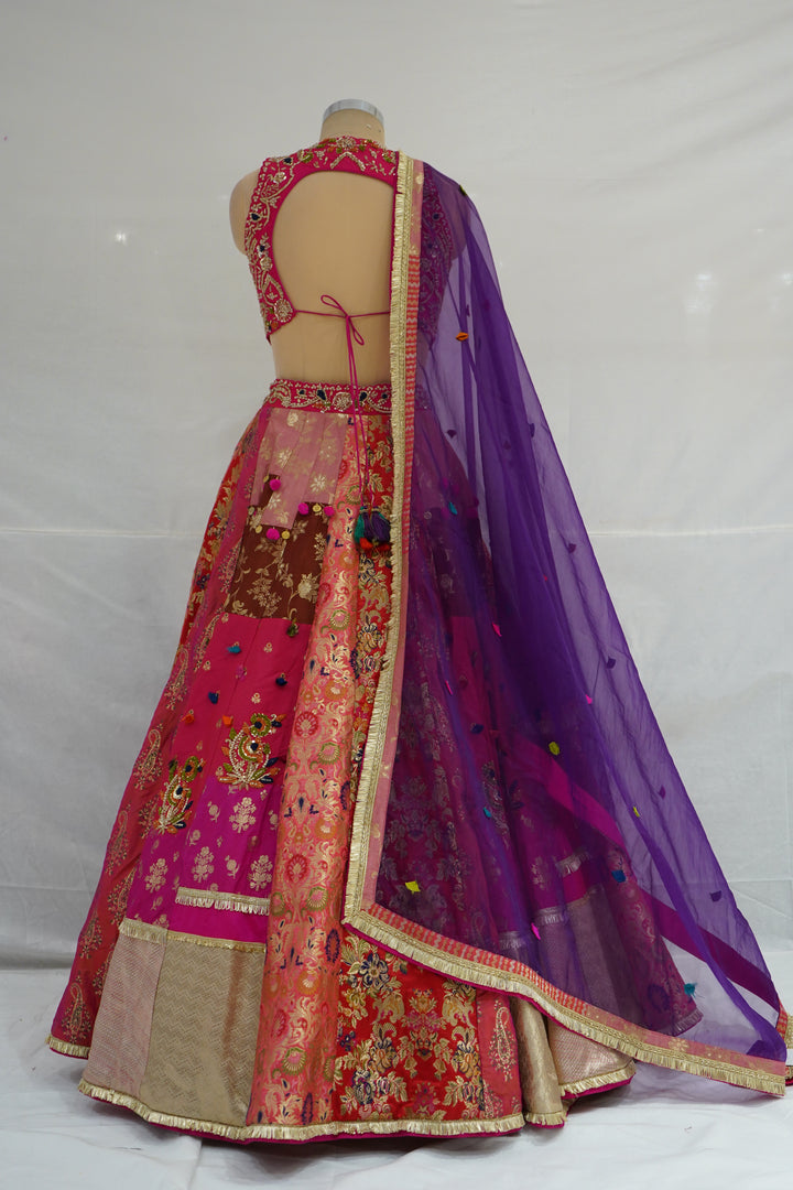 Rani Pink & Multicolour Banarasi Woven Designer Lehenga Choli with Purple Net Dupatta