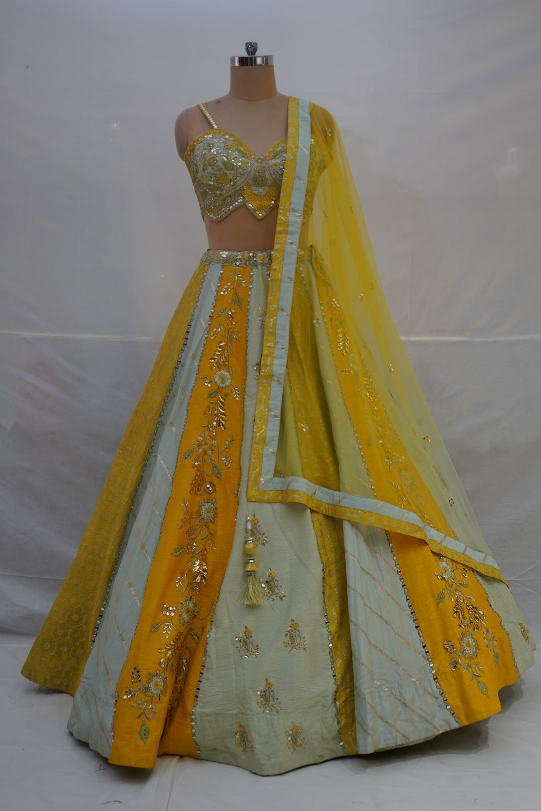 Mustard Yellow & Mint Green Designer Lehenga Choli with Embroidered Panels and Net Dupatta