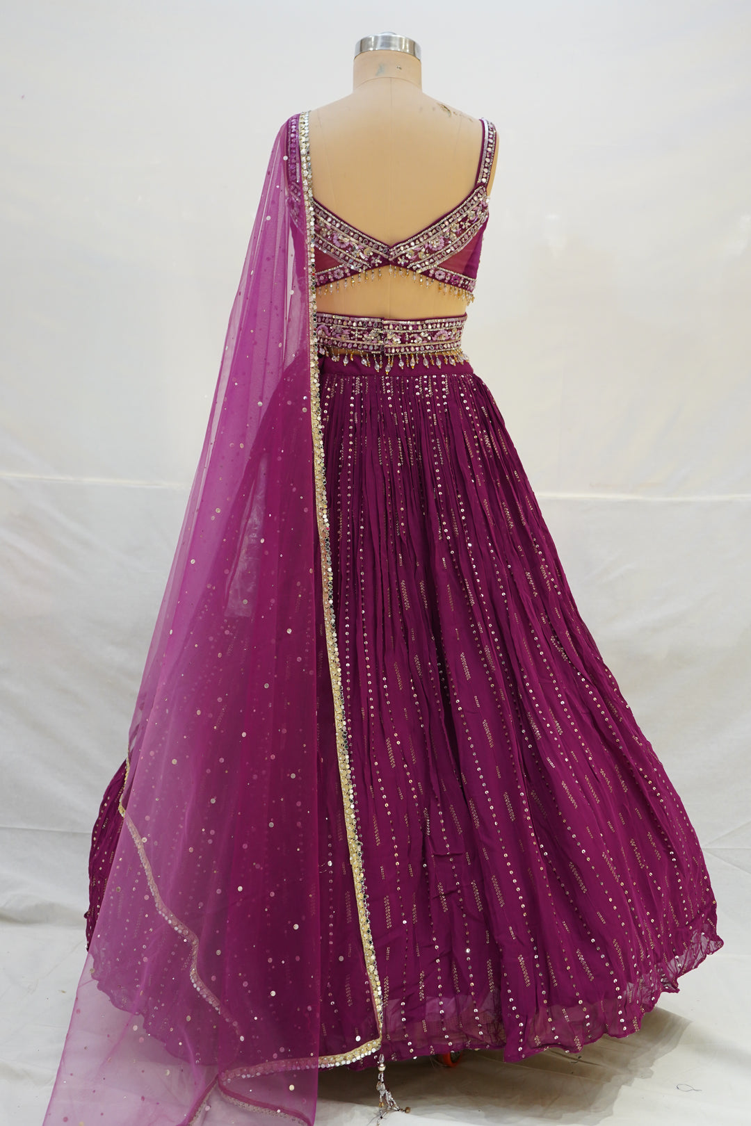 Deep Wine Pleated Lehenga Choli with Embellished Cross Blouse & Sheer Dupatta