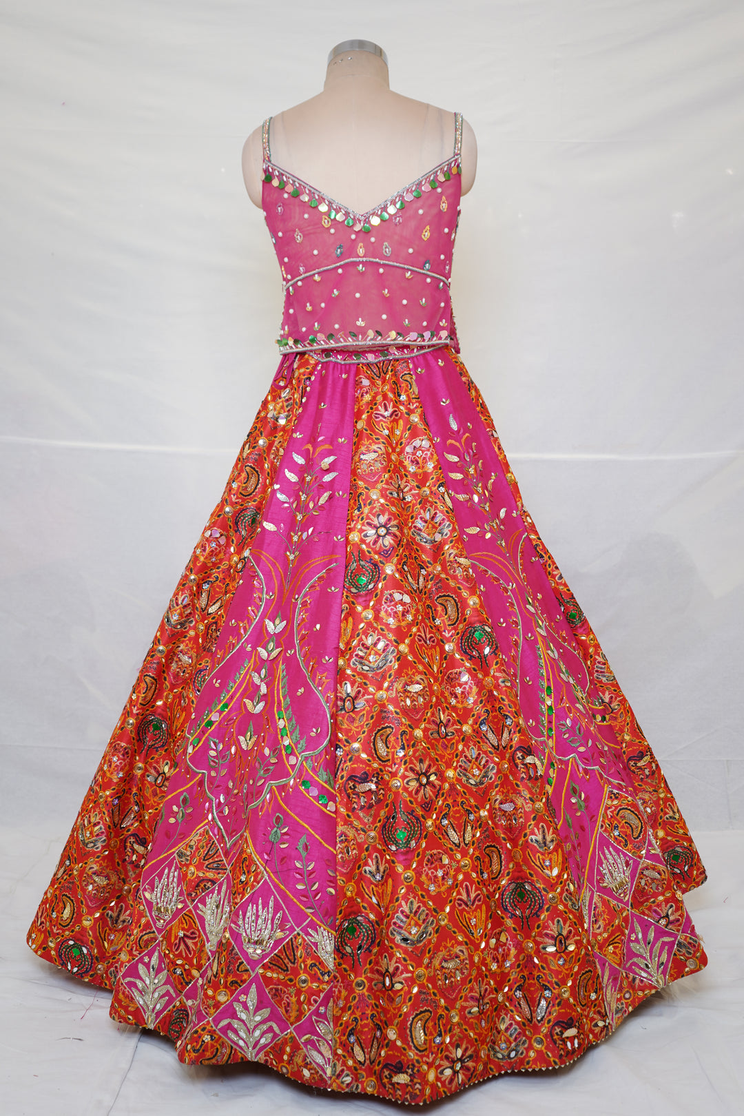Rani Pink & Orange Embroidered Lehenga Set with Multicolor Blouse & Net Dupatta