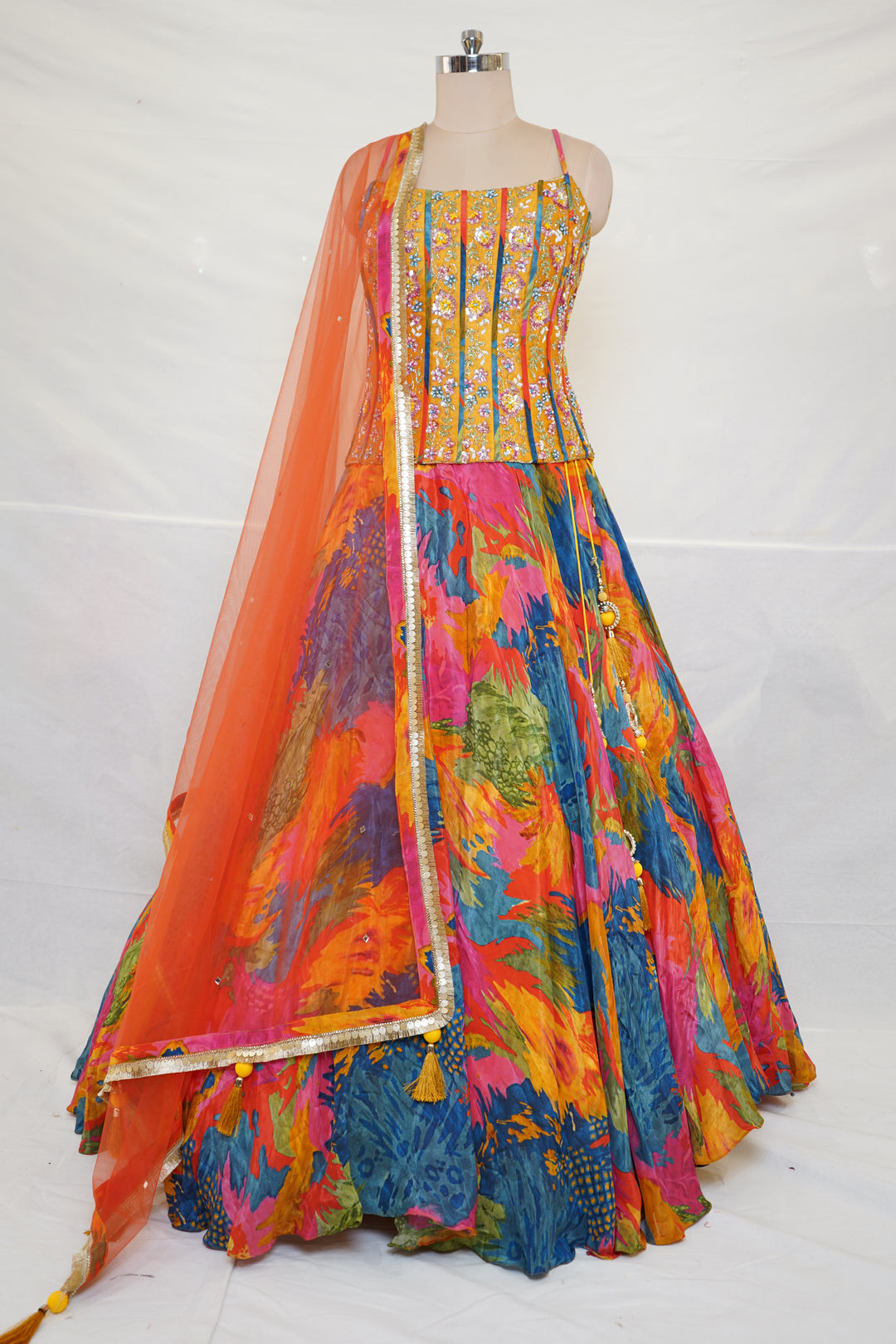 Abstract Multicolor Printed Lehenga Set with Embroidered Bustier & Orange Dupatta