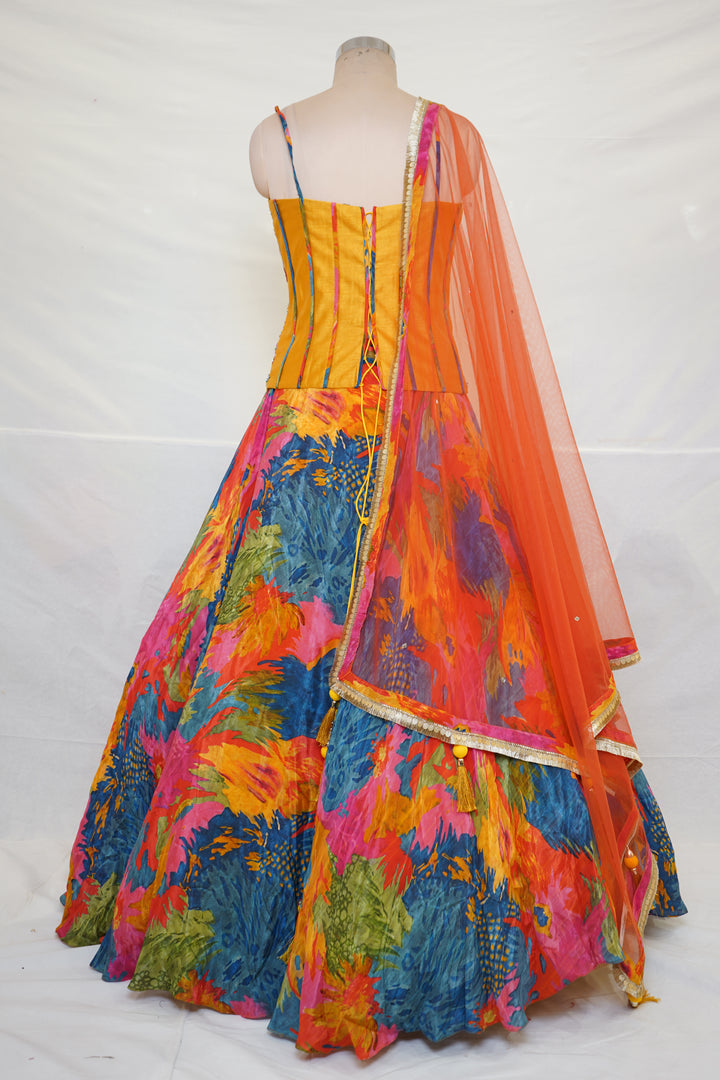 Abstract Multicolor Printed Lehenga Set with Embroidered Bustier & Orange Dupatta