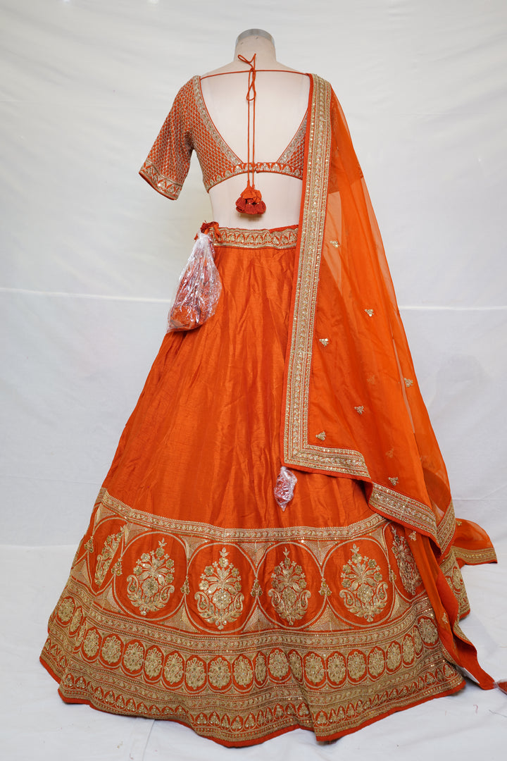 Vibrant Orange Silk Lehenga Choli with Zari Border & Dupatta