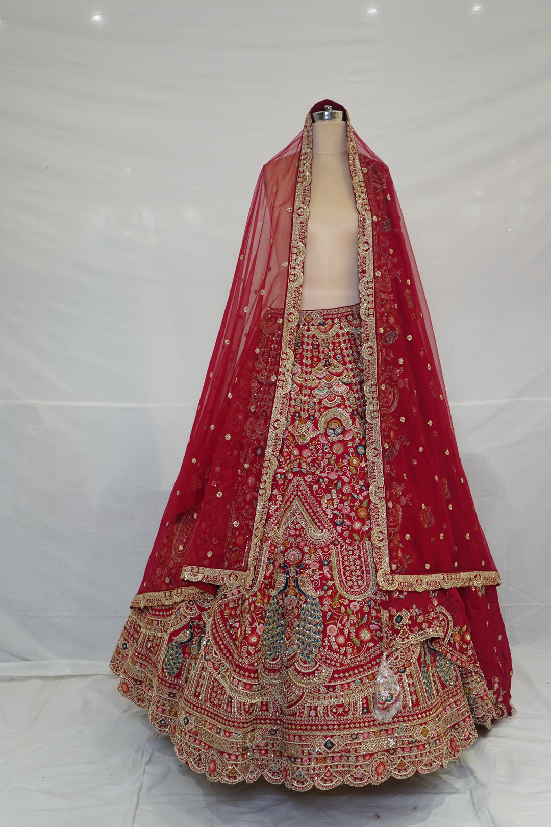 Royal Ruby Red Bridal Lehenga Set with Peacock Motifs & Heritage Zardozi Embroidery