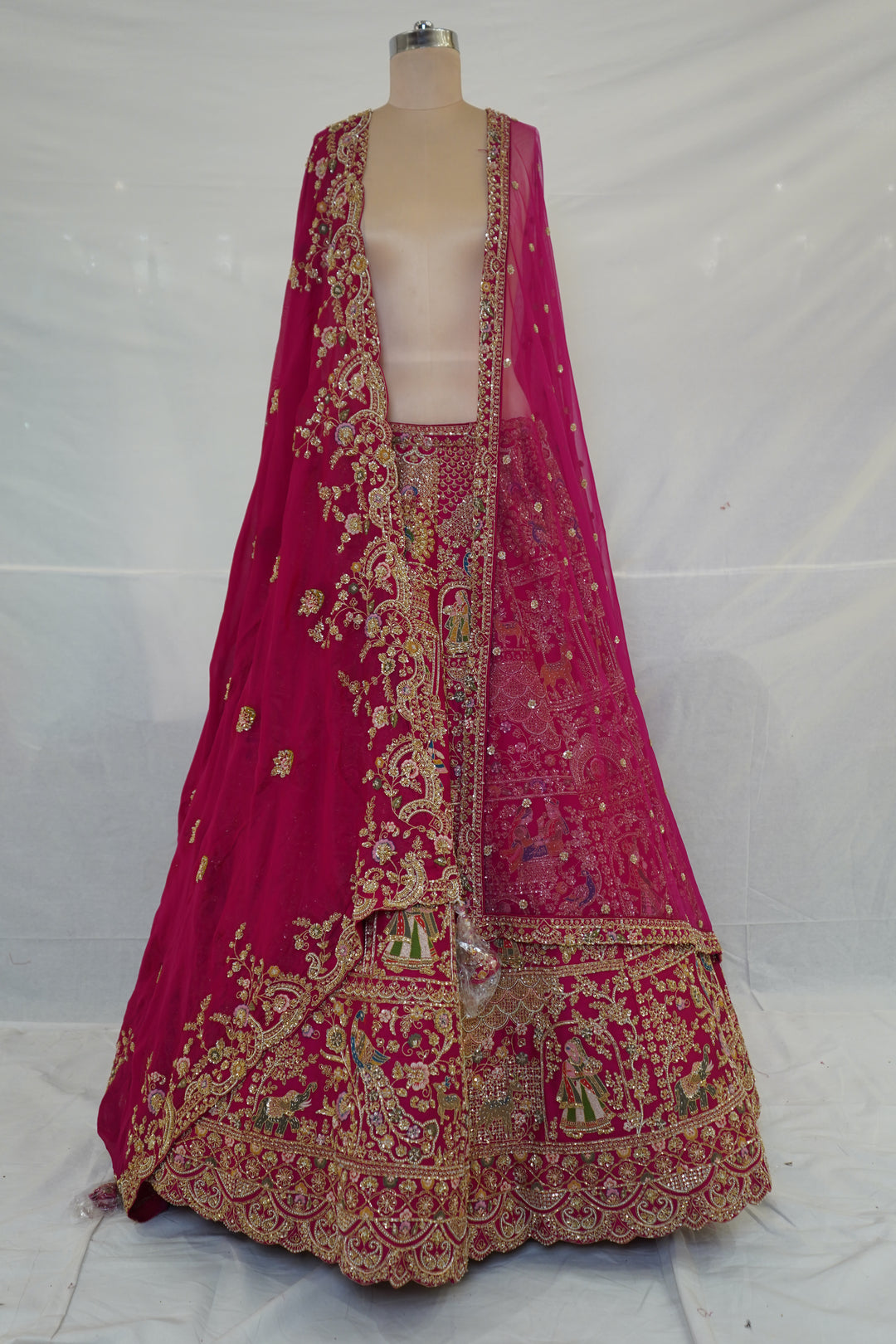 Rani Pink Royal Bridal Lehenga Set with Heritage Motif Embroidery & Designer Net Dupatta