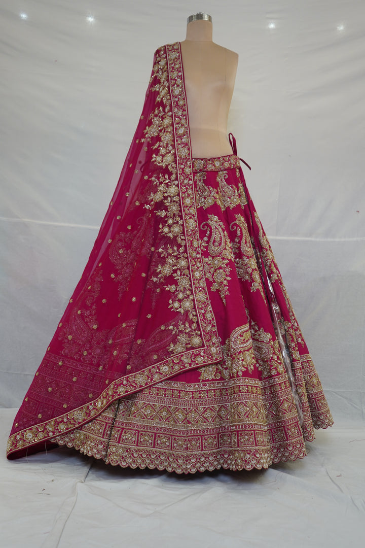 Rani Pink Designer Bridal Lehenga Set with Paisley Zari Embroidery & Embellished Net Dupatta