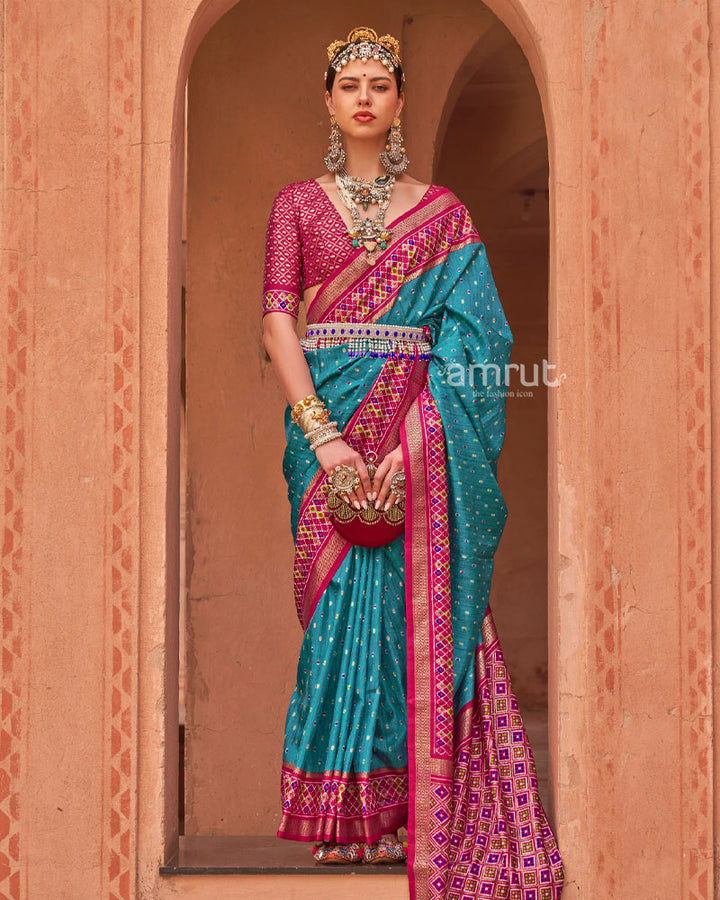 Dusty Blue Printed Pure Patola Silk Saree With Pink Contrast Pallu