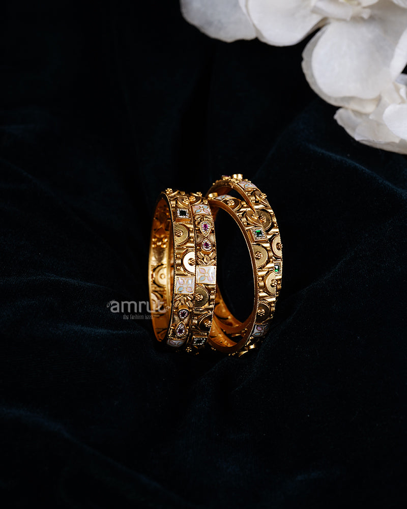 Four Gold Toned Bangles Set with Colorful Gemstones and Enamel Detailing 01