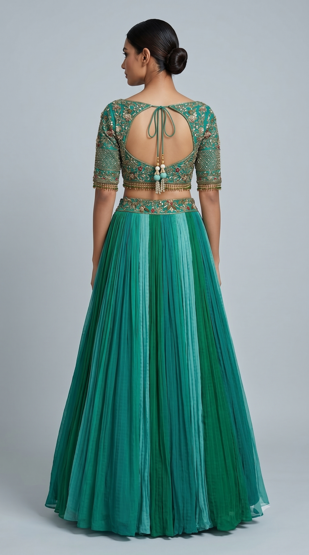 Teal Green Embroidered Crop Top with Pleated Lehenga Skirt