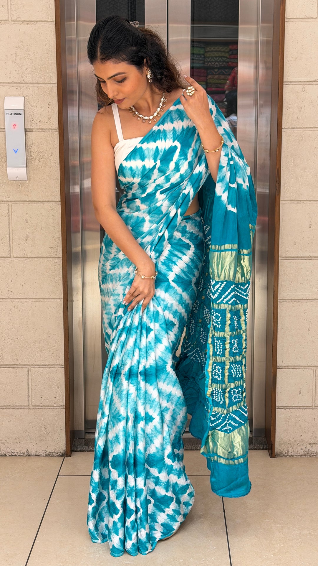 Turquoise Blue Bandhani Silk Saree with Zari Border & Traditional Pallu