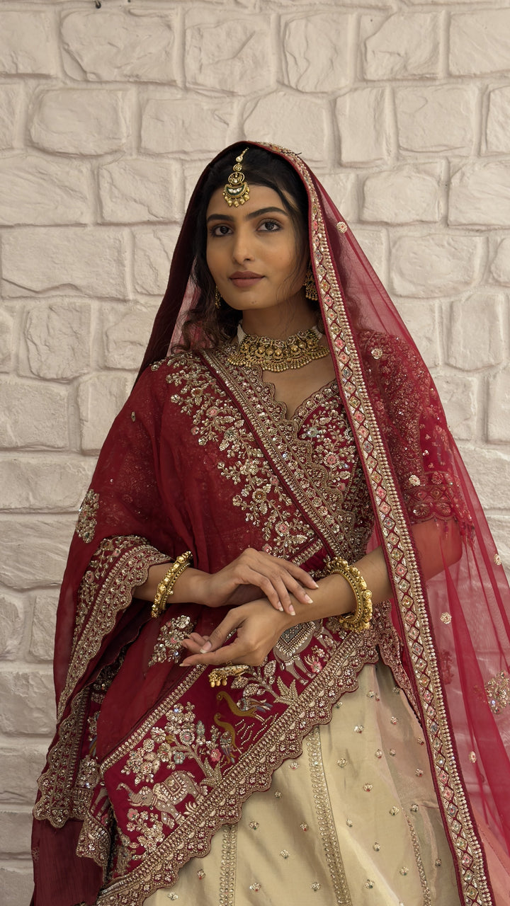 Ivory & Maroon Royal Bridal Lehenga Set with Heritage Embroidery and Net Dupatta