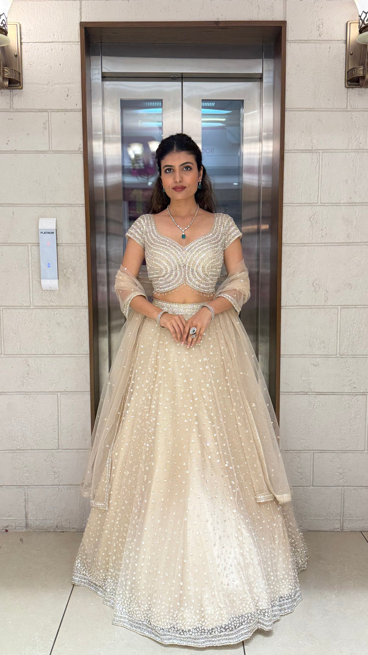 Champagne Sequin Embellished Lehenga with Wave Pattern Blouse & Sheer Dupatta