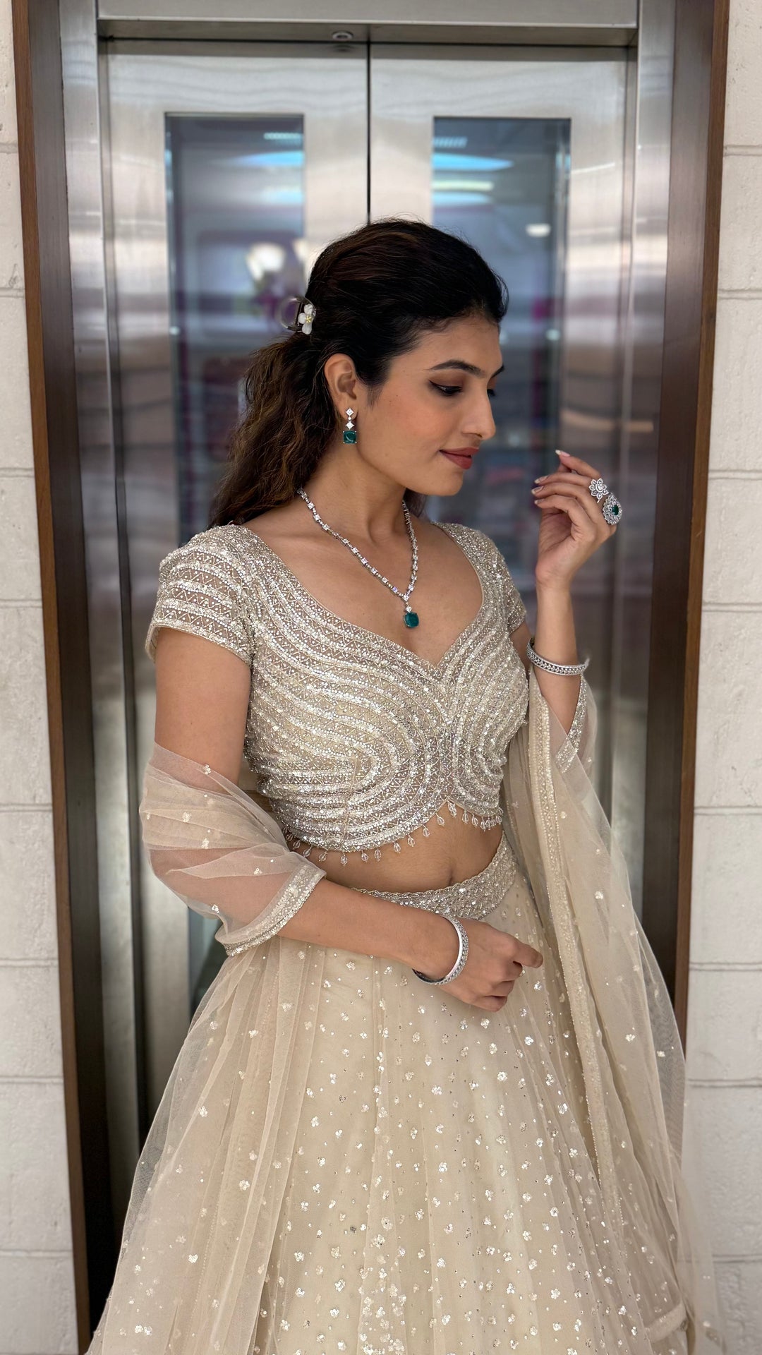 Champagne Sequin Embellished Lehenga with Wave Pattern Blouse & Sheer Dupatta